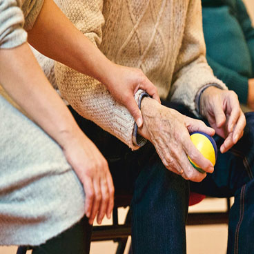 Holding hands of elderly person
